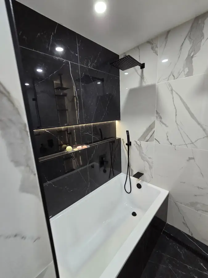 Black and white tub wall