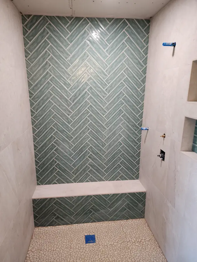 Herringbone shower with bench
