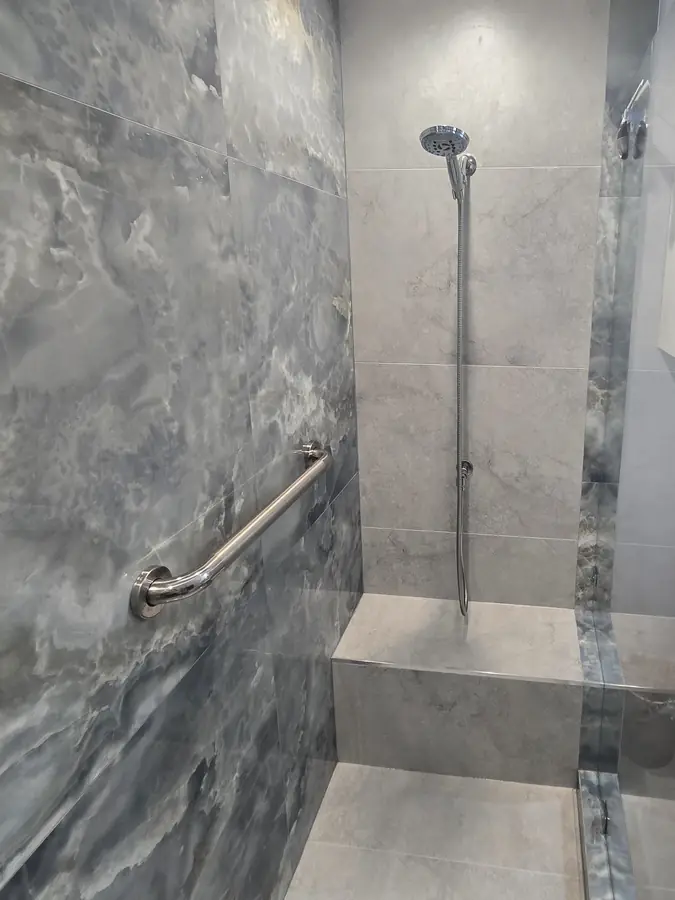 Blue stone shower with bench